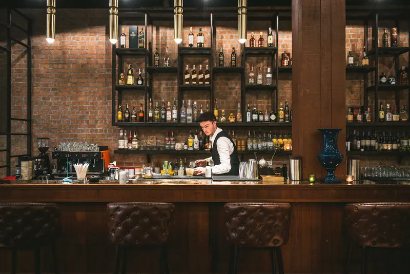 Chow's long bar lined with spirits and warm lights