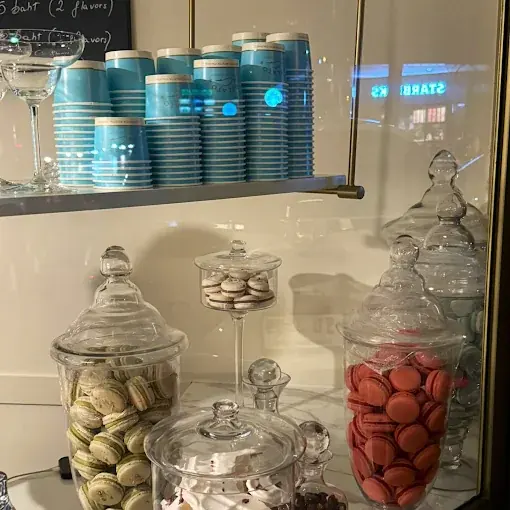 Gelato & Co's display with blue cups and glass jars of sweets